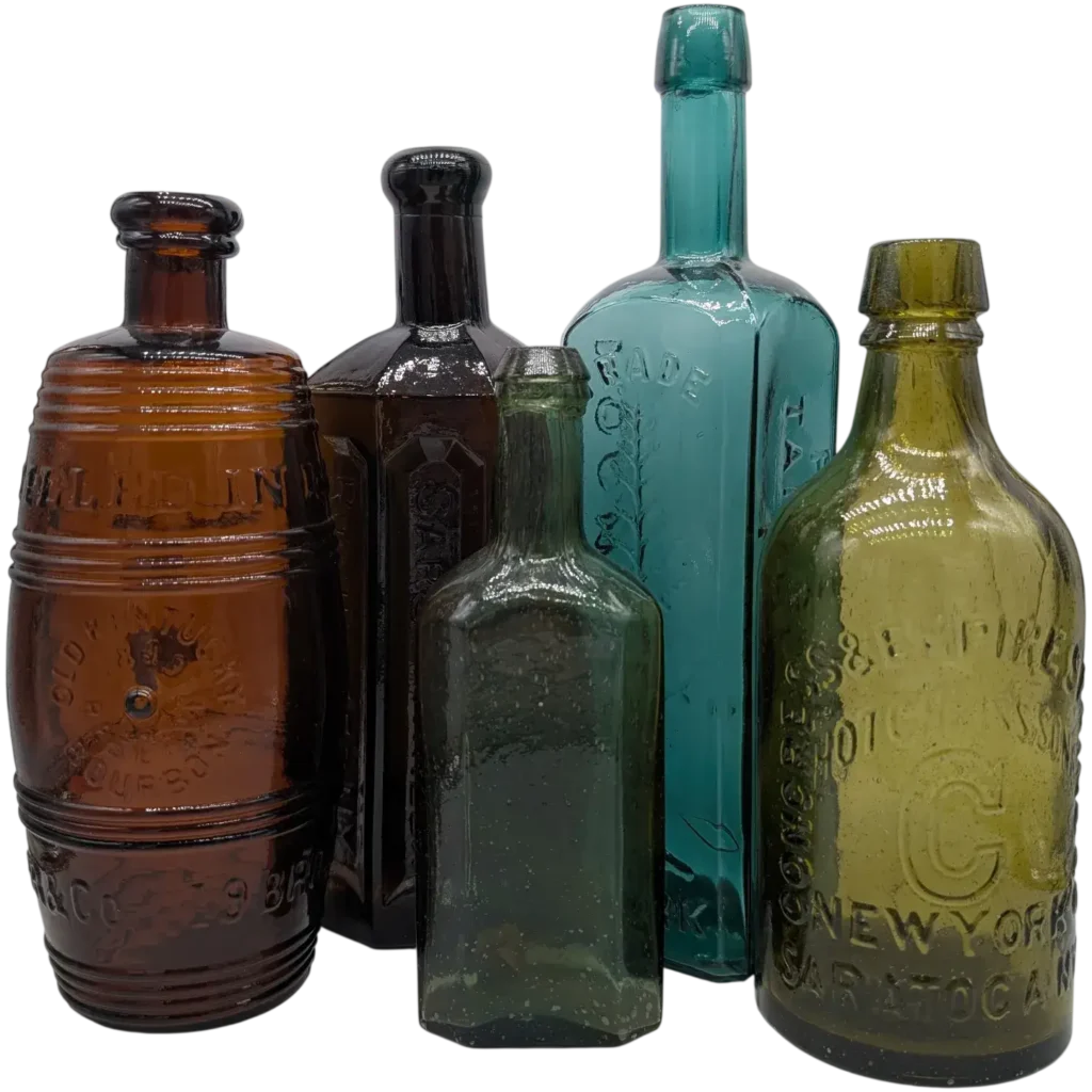 A Multi-Colored Collection of Antique Bitter Bottles Arranged in a Horizontal Line.